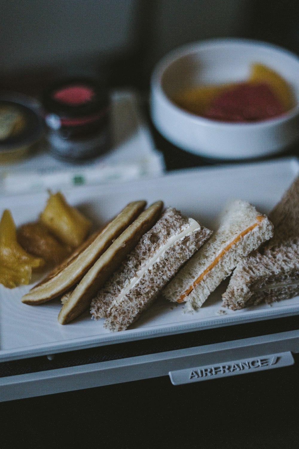 a white plate topped with sandwiches and pickles