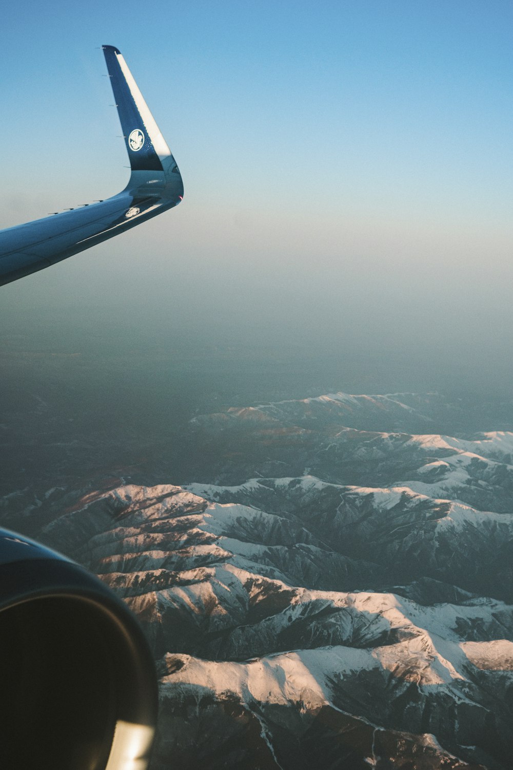 a view of the mountains from an airplane window