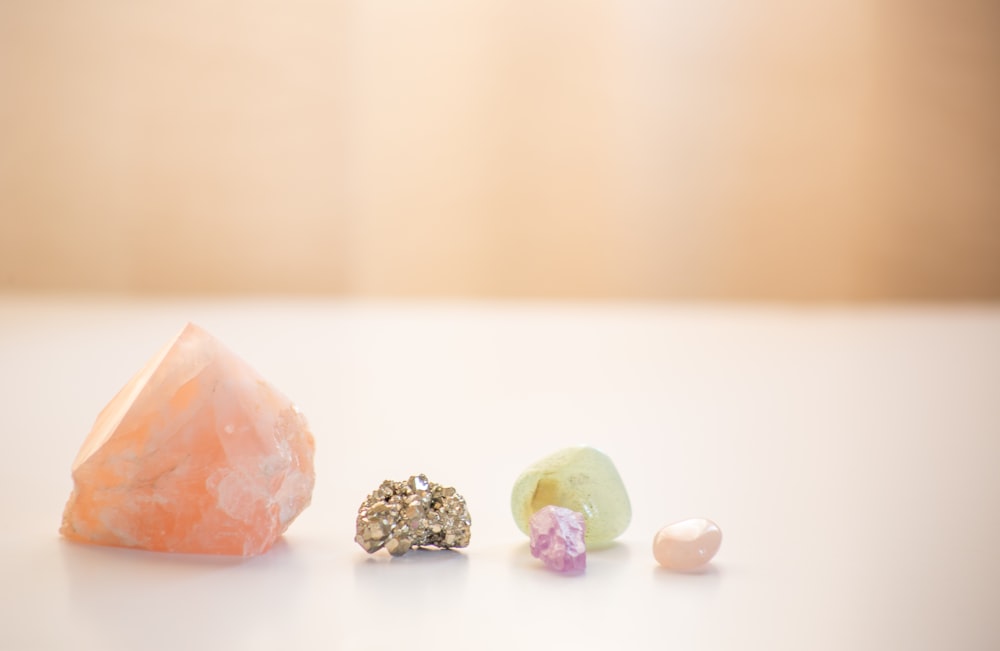 a couple of small pieces of jewelry sitting on top of a table