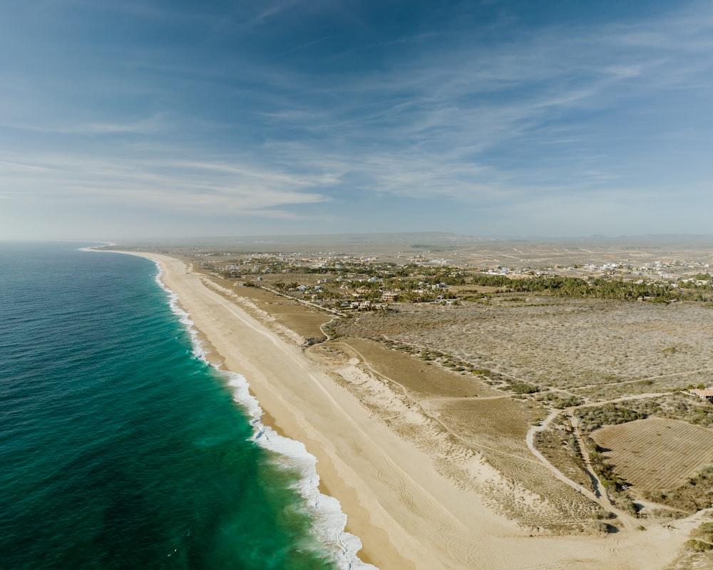 an aerial view of a beach and ocean