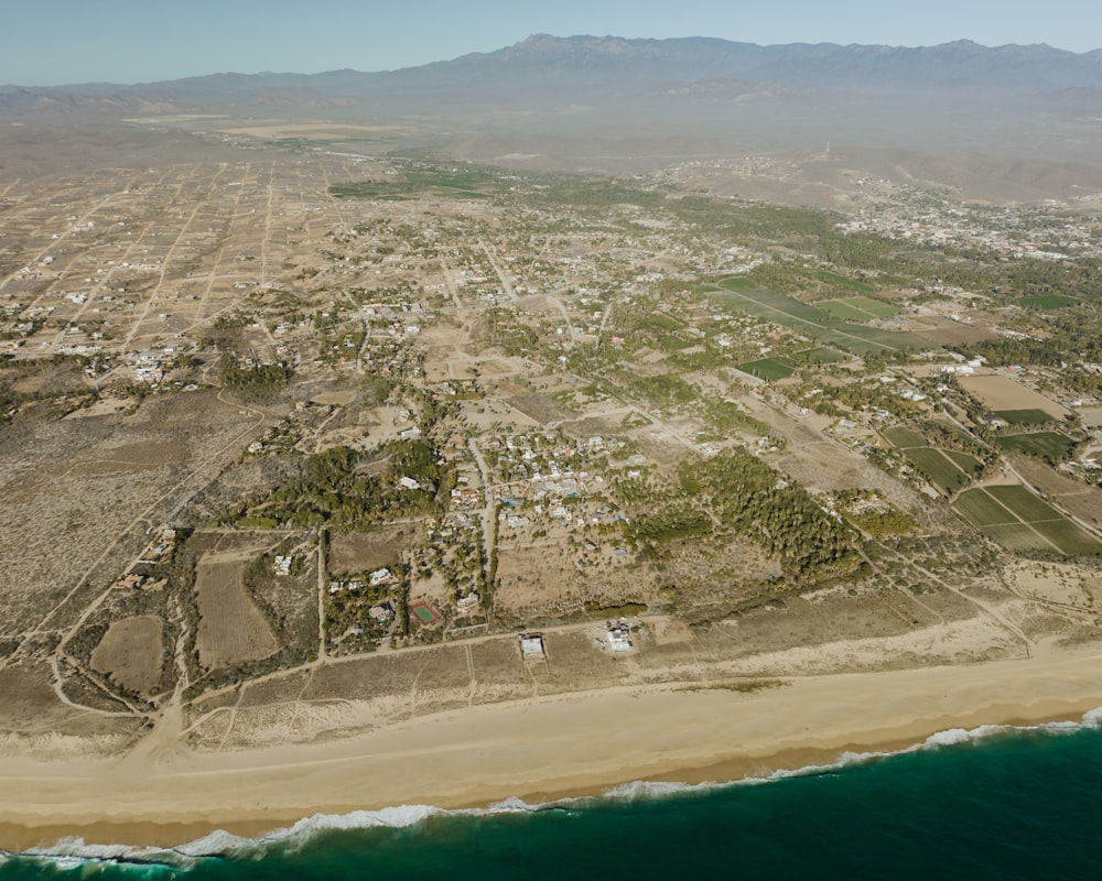 an aerial view of a beach and a town