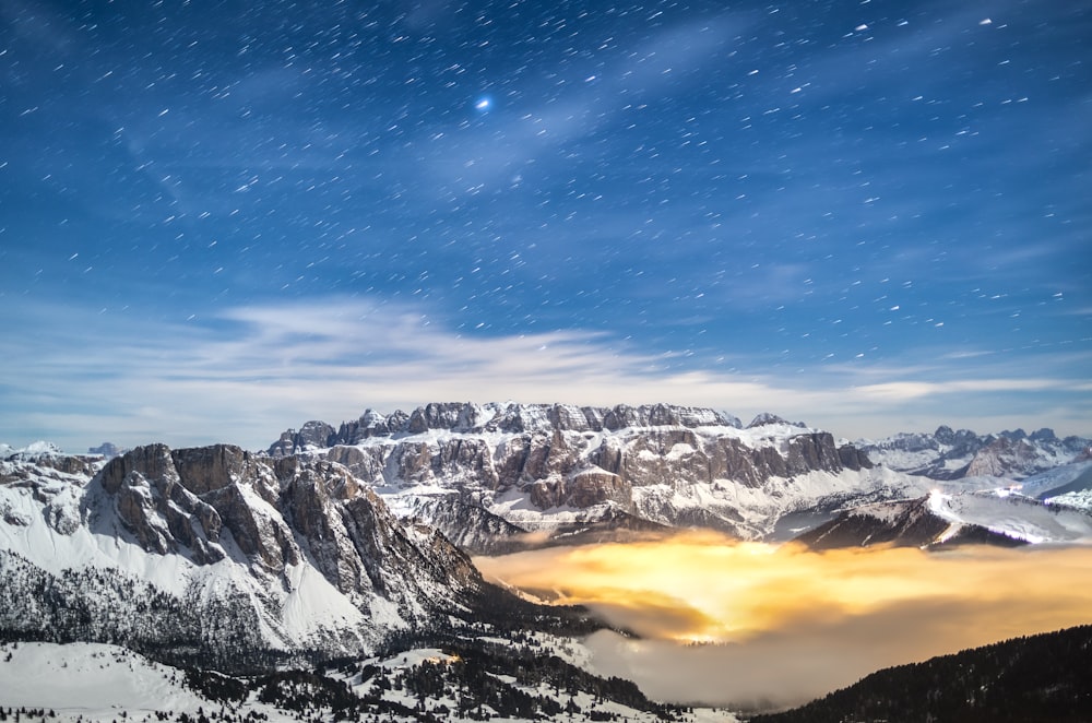 a view of a mountain range covered in snow