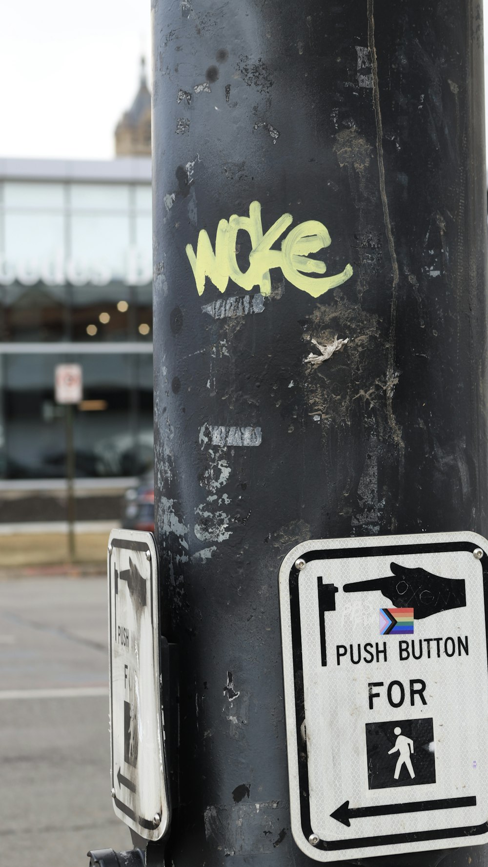 a close up of a pole with some stickers on it