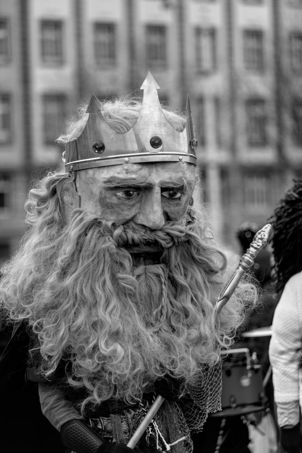 a man with a long beard and a crown on his head