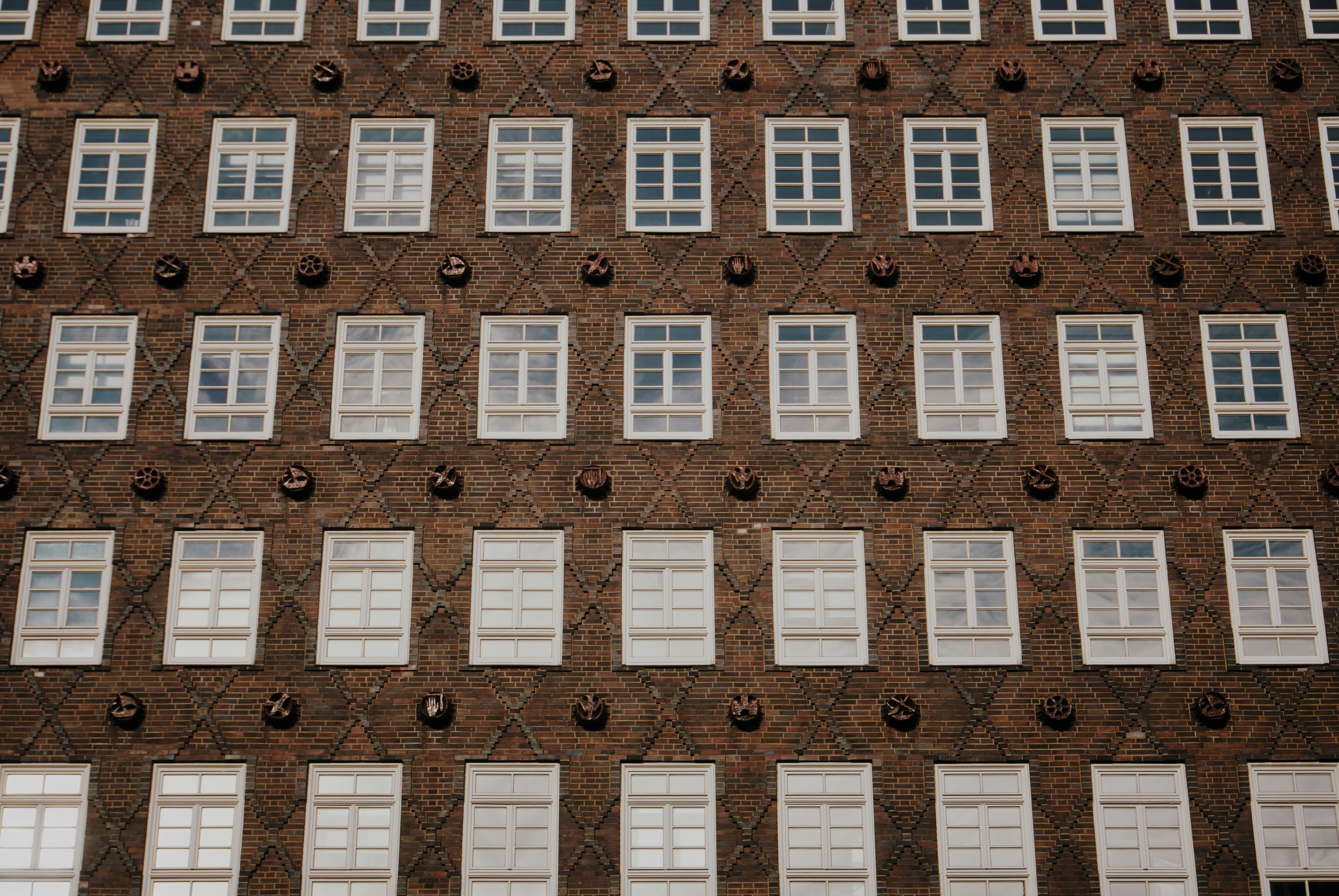 a tall brick building with lots of windows