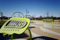 Workers installing eco-friendly street furniture in a public park.
