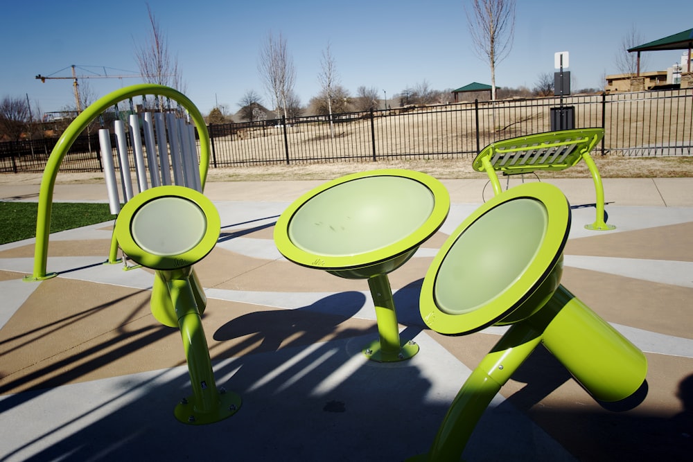 a couple of green chairs sitting next to each other