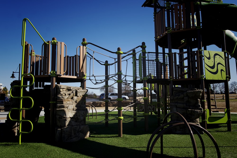 a children's play area with a rock wall and climbing equipment