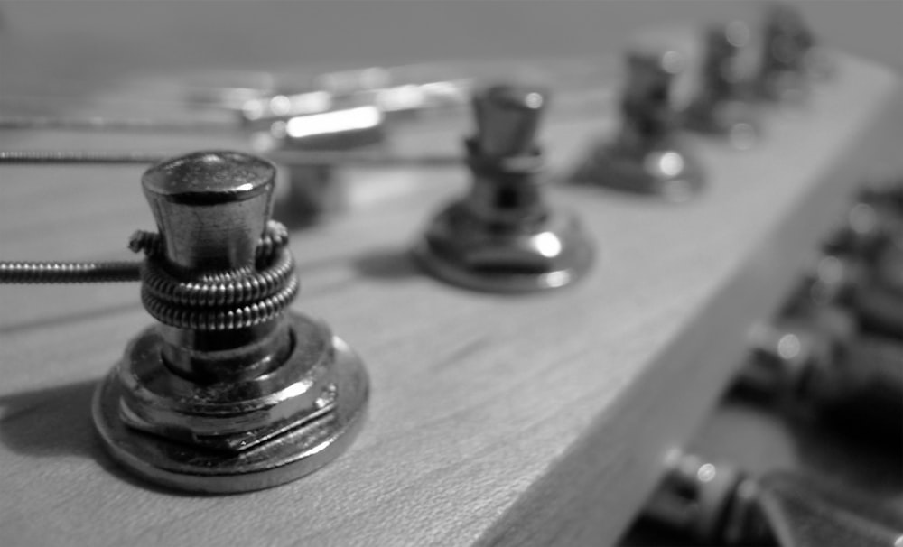 a close up of a faucet on a wooden surface