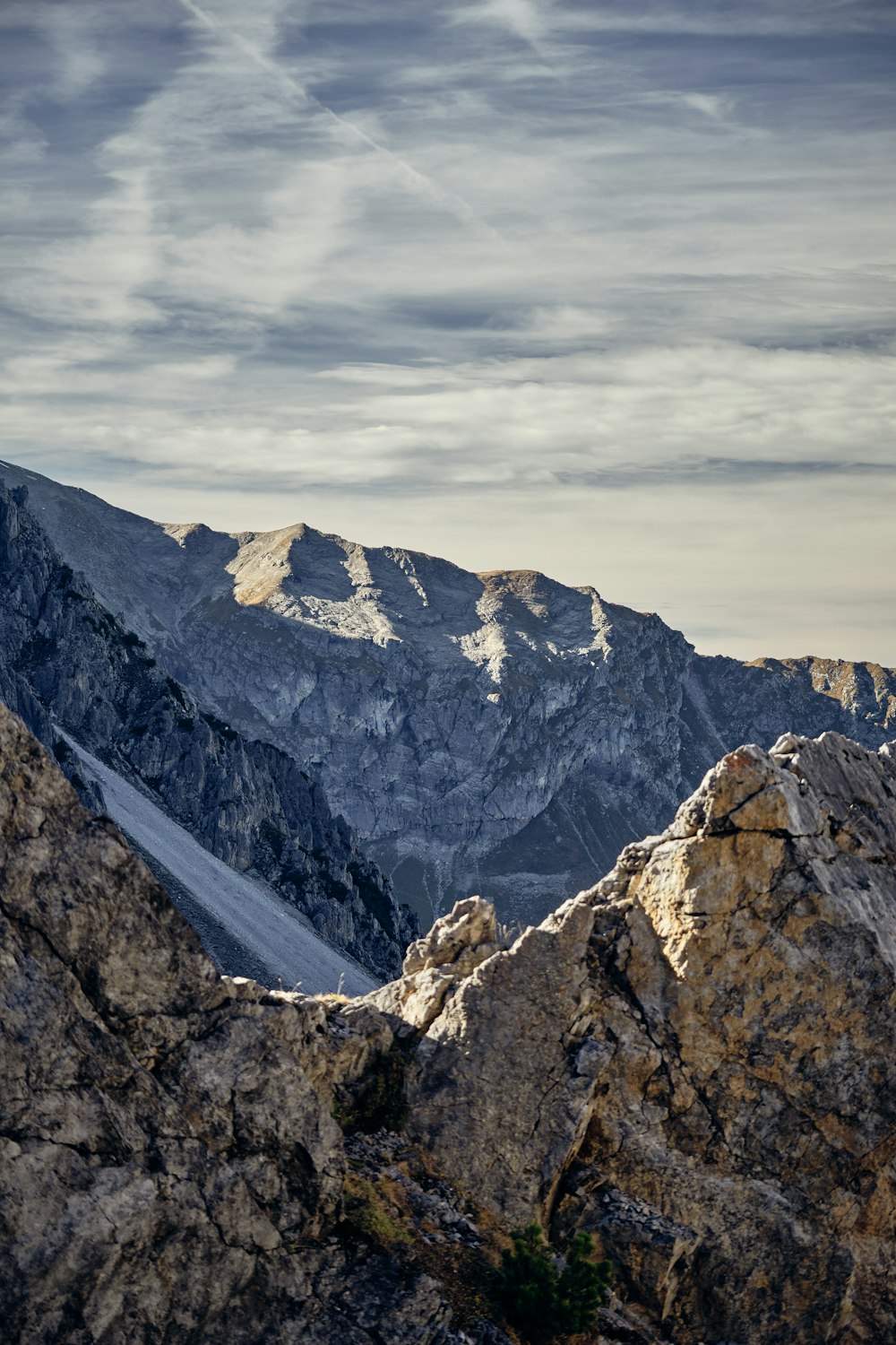 a view of the mountains from the top of a mountain