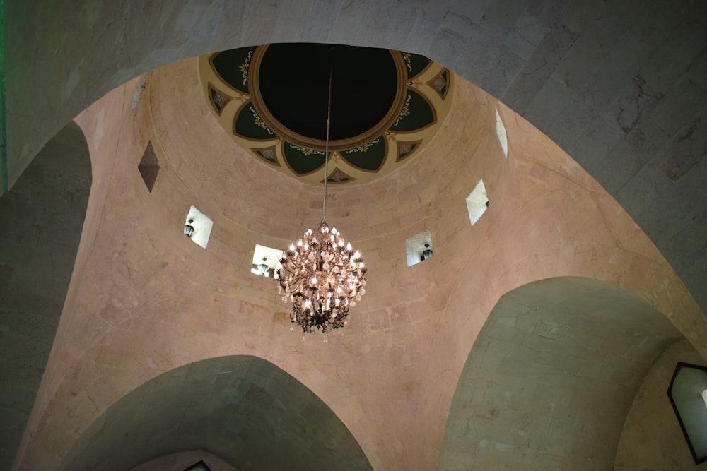 a chandelier hanging from the ceiling of a building