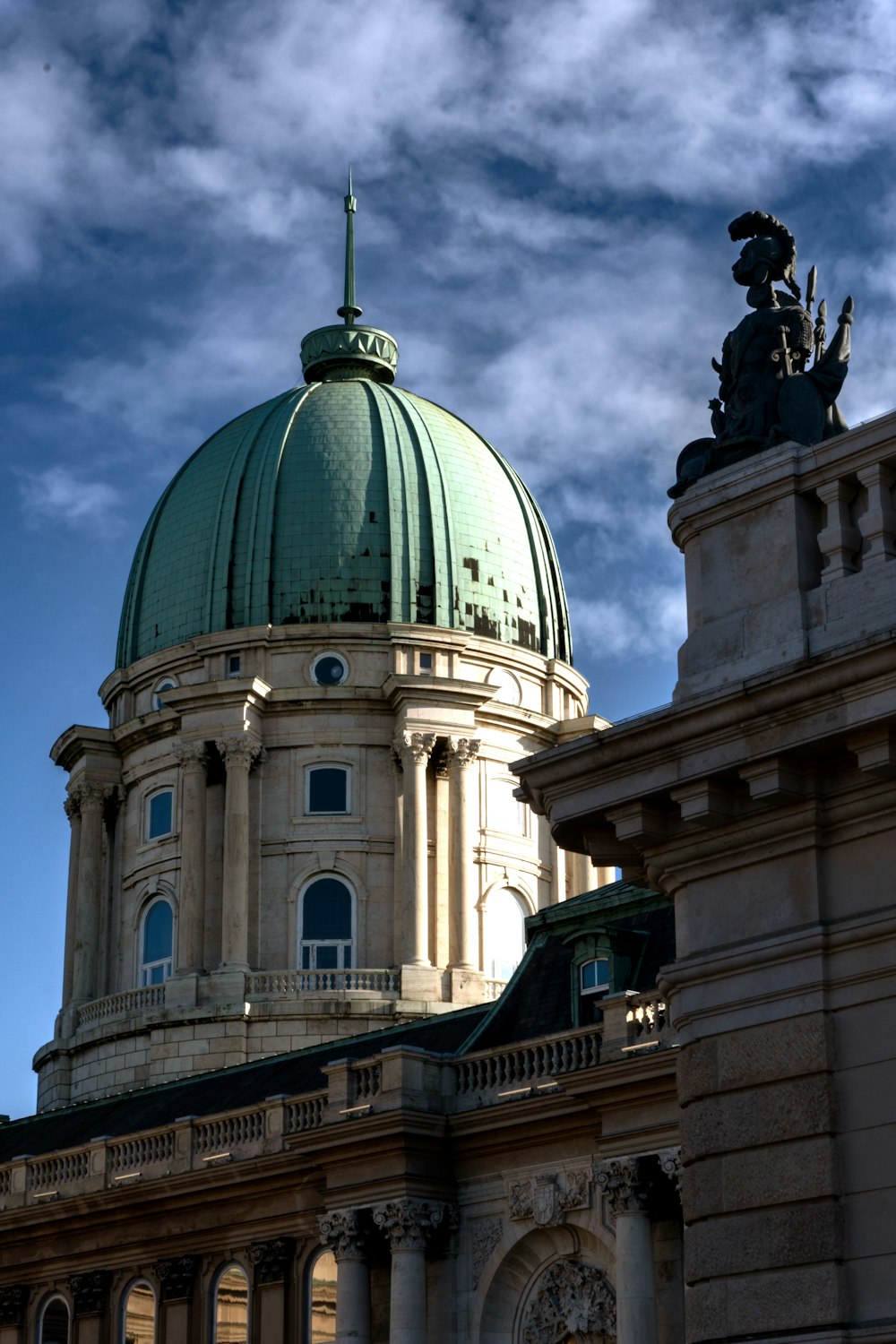 a large building with a green dome on top