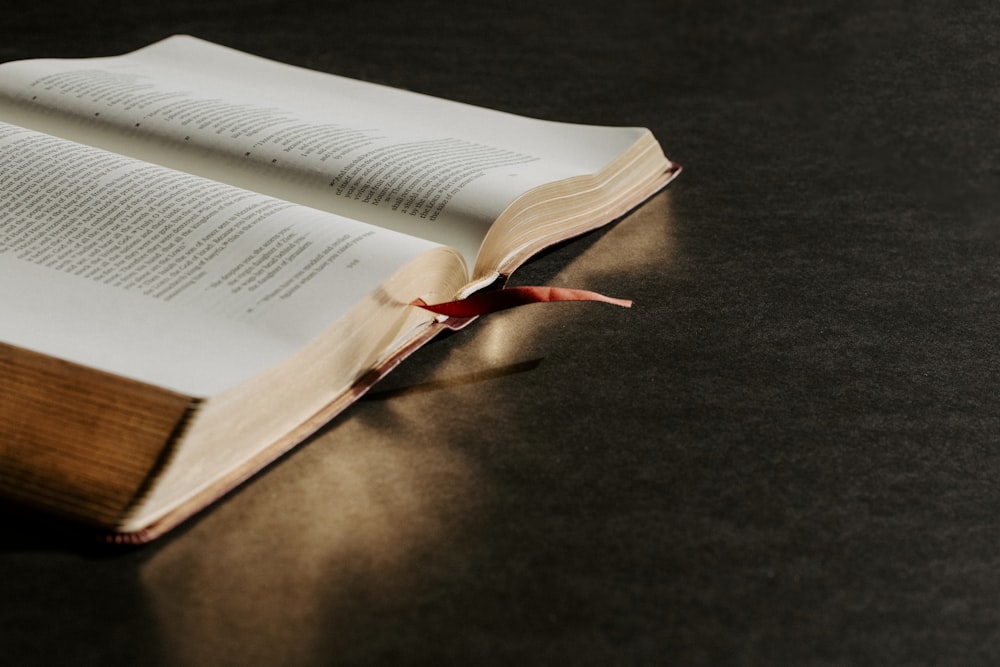 an open book sitting on top of a table