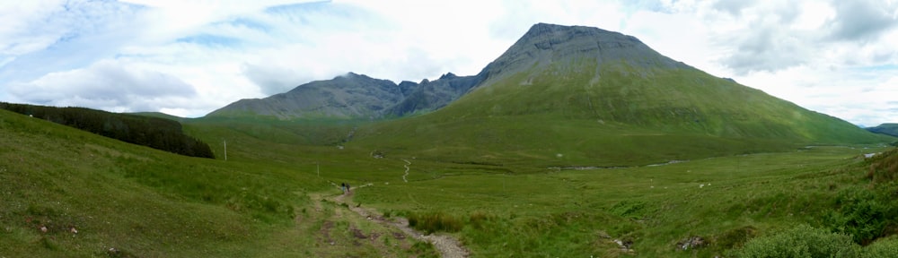 a view of a mountain with a trail going through it