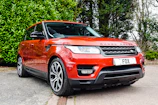 Close-up of a sleek Range Rover air suspension system with gold accents.
