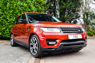 Close-up of a sleek Range Rover air suspension system with gold accents.