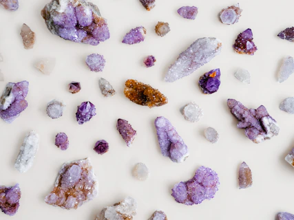 a group of rocks and crystals on a white surface