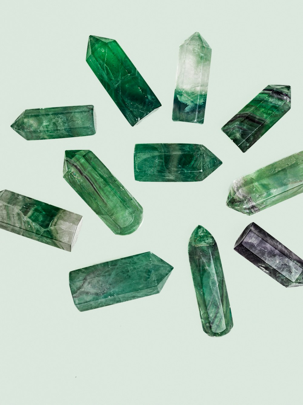 a group of green crystals arranged in a circle