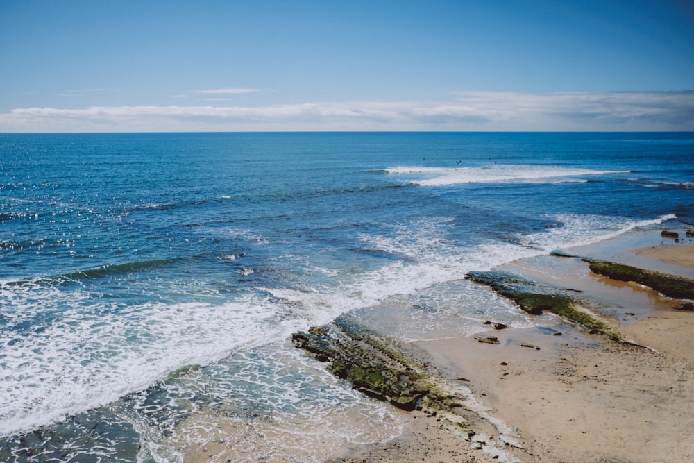 a body of water with waves coming in and out of it