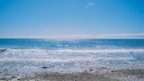 A serene beach view outside the office window, symbolizing hope and recovery.