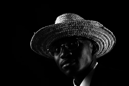 Lifestyle photo of a person wearing a handmade crochet hat in warm minimalist style, surrounded by natural light and soft shadows.