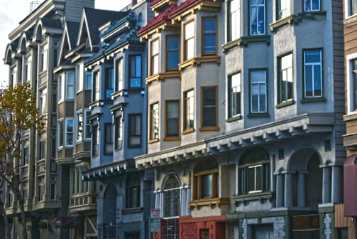 A neighborhood street showing several affordable housing units side by side.