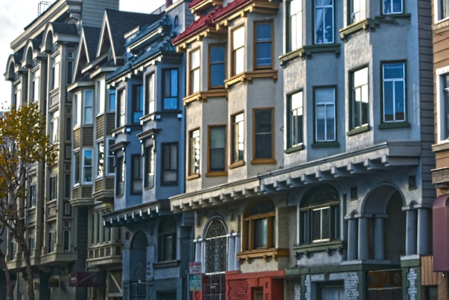 A neighborhood street lined with multiple fourplex buildings, illustrating community living