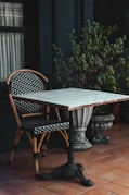 a table and two chairs sitting on a patio