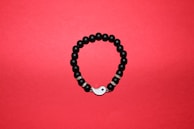 A handcrafted bracelet with mixed textures symbolizing balance and harmony.