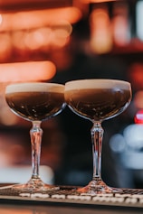 a couple of glasses that are sitting on a table