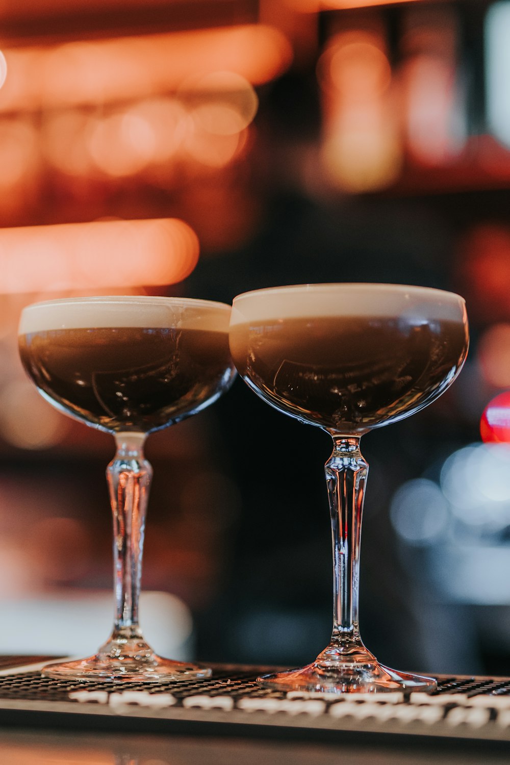 a couple of glasses that are sitting on a table