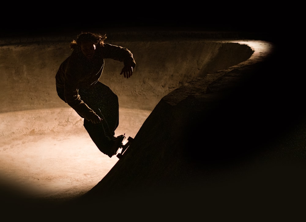 a man riding a skateboard up the side of a ramp