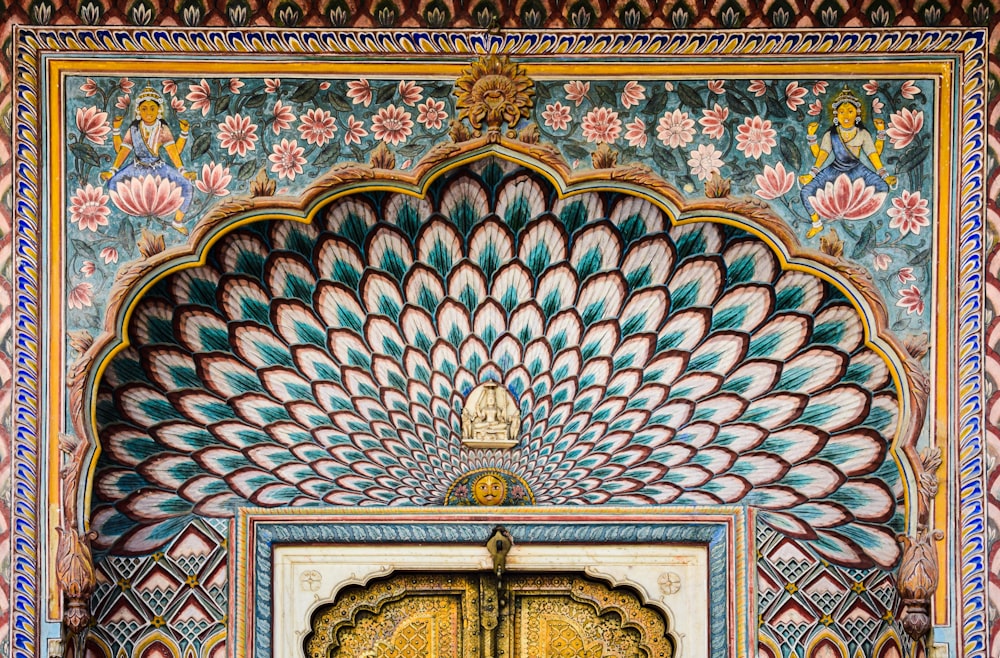 an ornate door with a peacock design on it