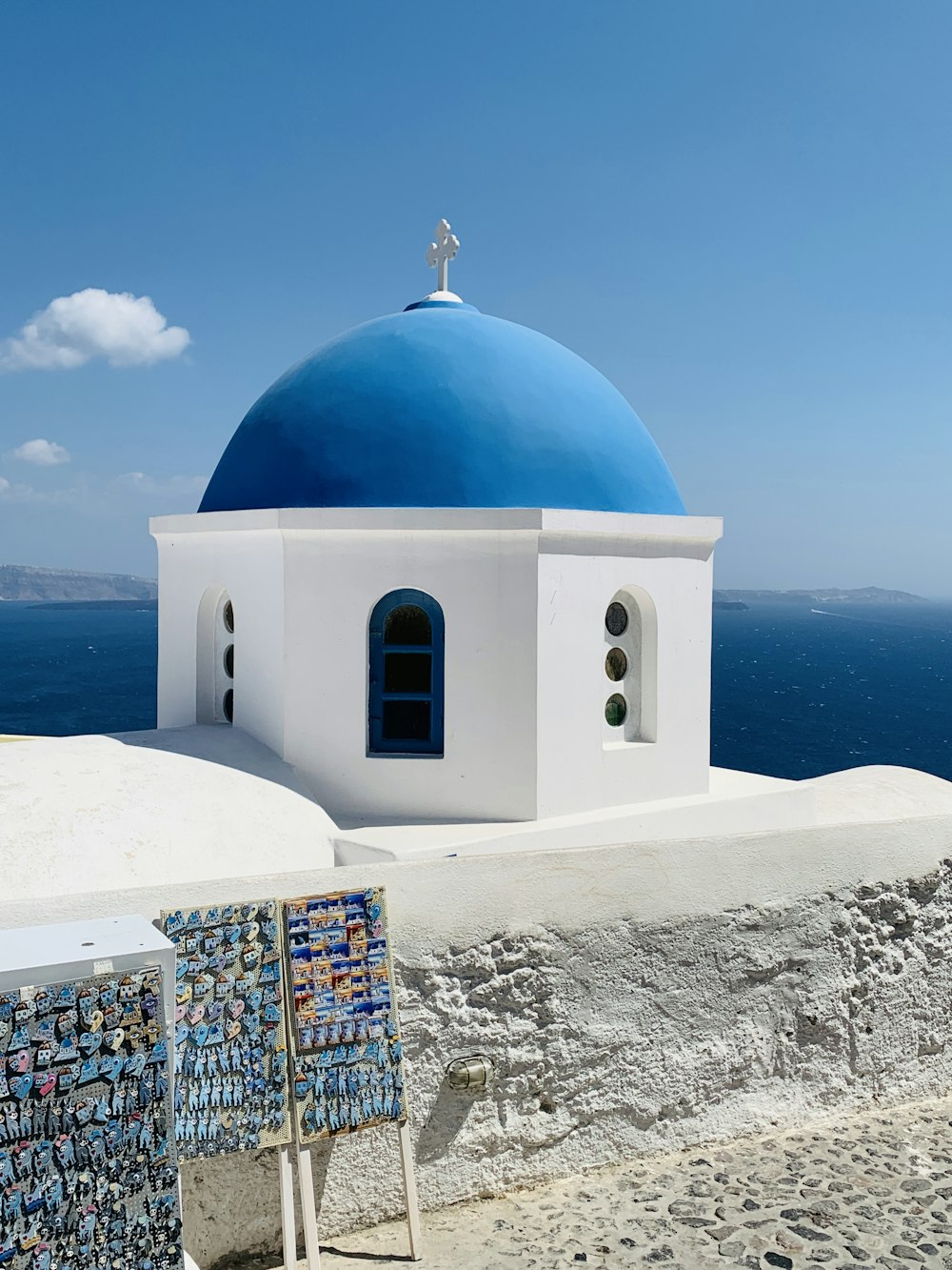 a white and blue building with a blue dome