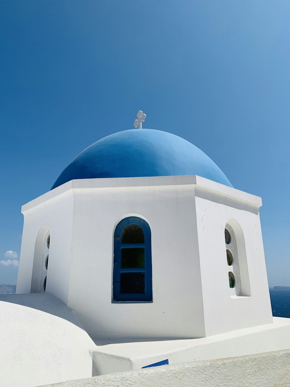 a white and blue building with a blue dome