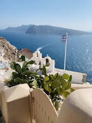 a view of a greek island from a balcony