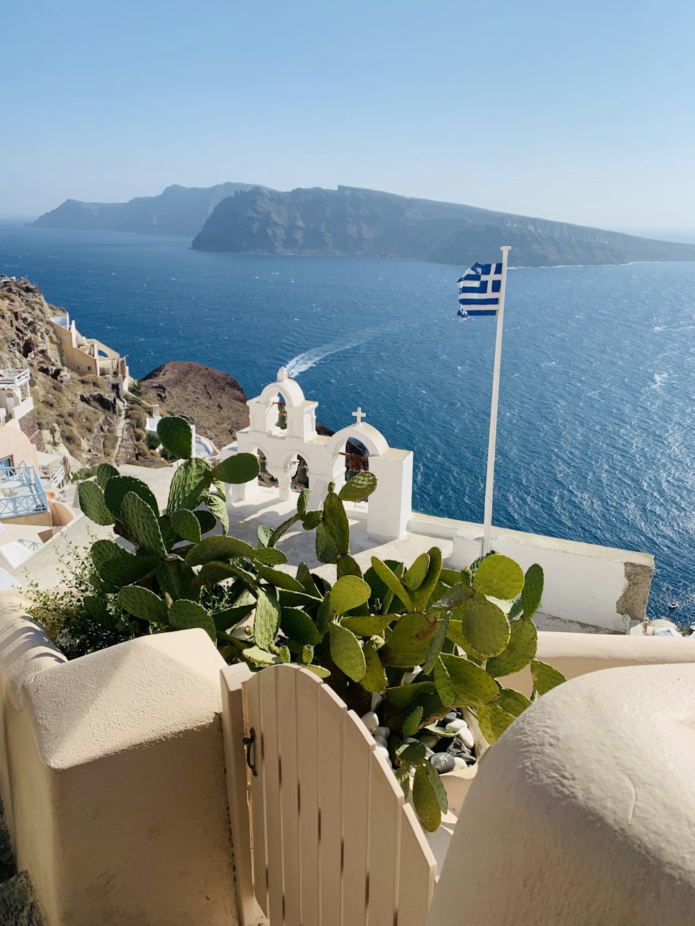a view of a greek island from a balcony
