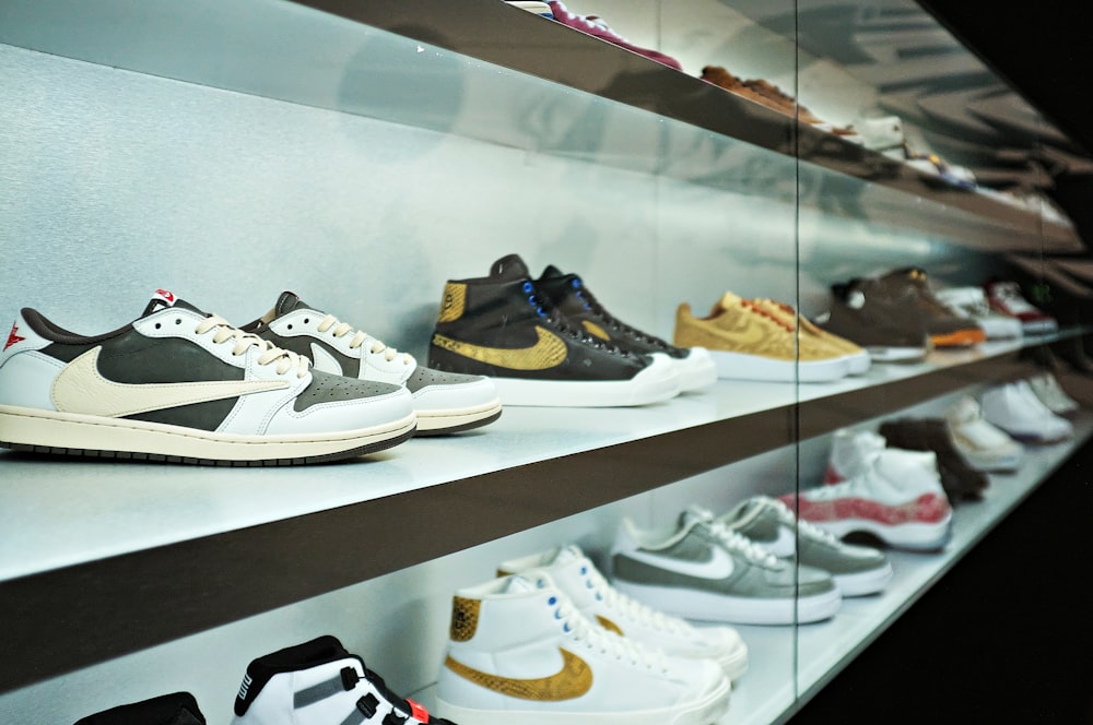 a row of nike shoes on display in a store