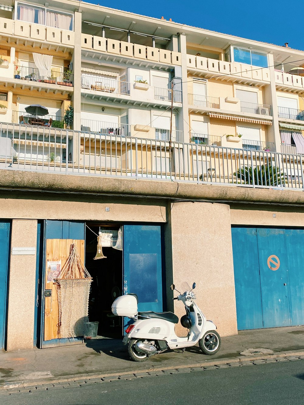 a scooter parked in front of a building