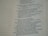 A close-up view of a page from a Bible, featuring passages in both regular and bold text. The text is formatted in a column with numbers preceding certain lines, set against a background of light-colored paper.