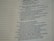 A close-up view of a page from a Bible, featuring passages in both regular and bold text. The text is formatted in a column with numbers preceding certain lines, set against a background of light-colored paper.