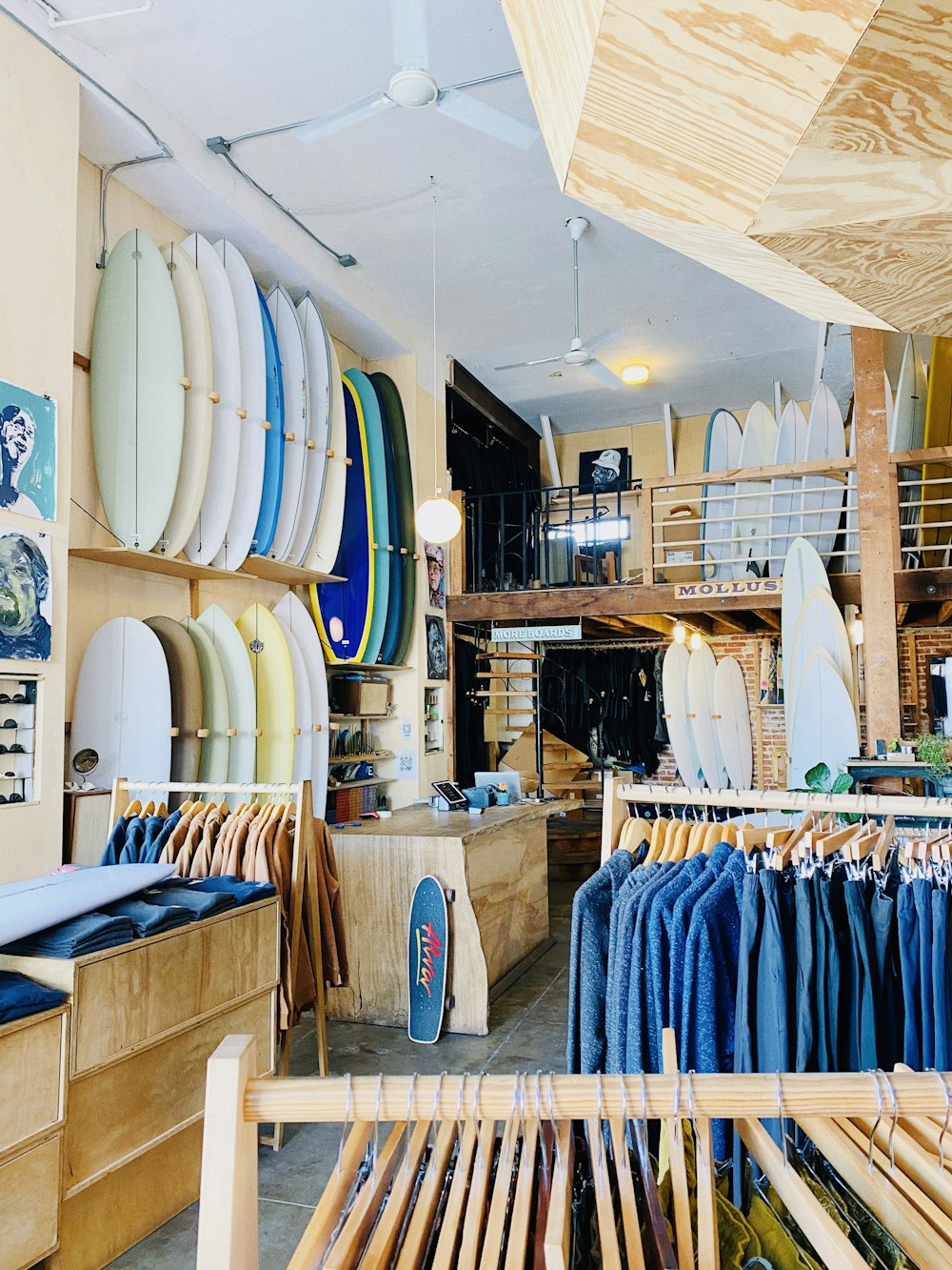 a surf shop filled with lots of surfboards