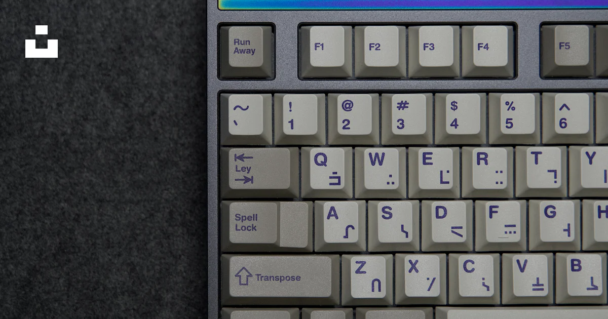 Keyboard Potrait A computer keyboard sitting on top of a table photo – Free Product ...
