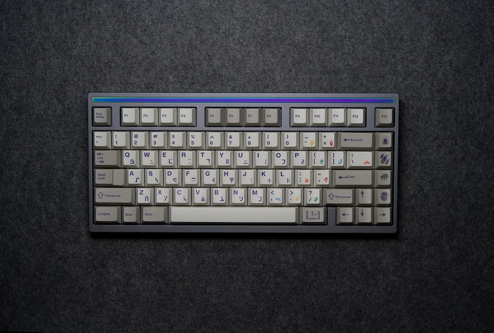 a computer keyboard sitting on top of a table