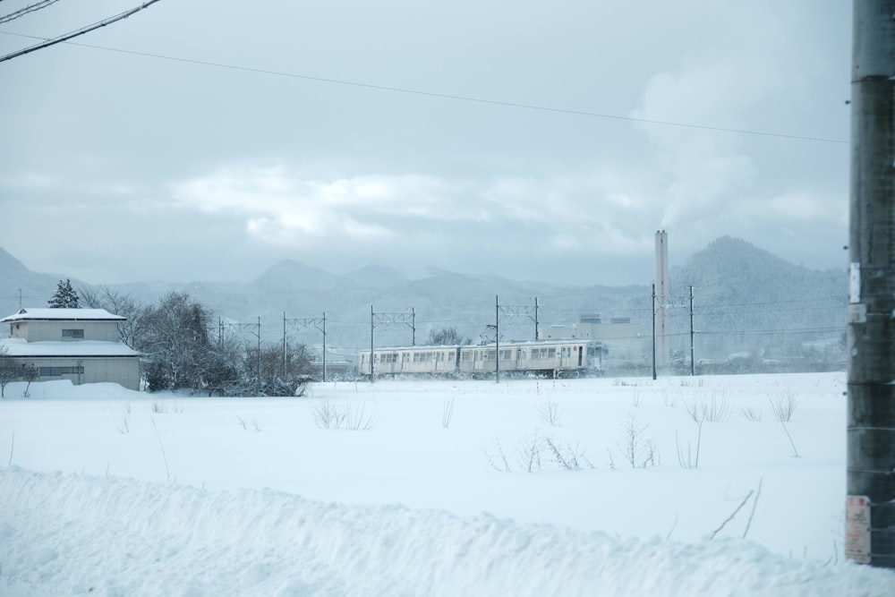 a train traveling through a snow covered countryside