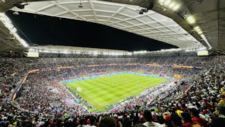 a large stadium filled with lots of people