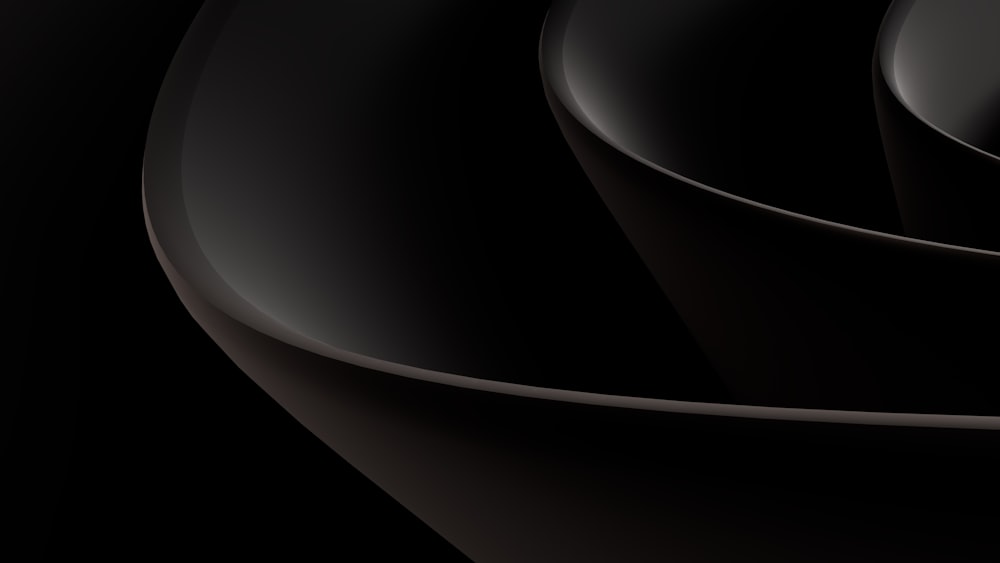 Un fondo negro abstracto con curvas y curvas