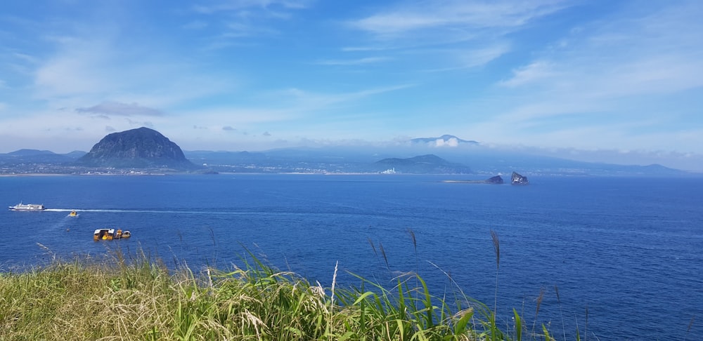 a body of water with a mountain in the background