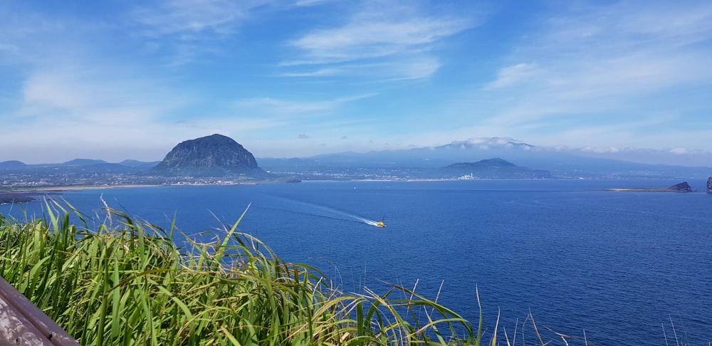 a view of a body of water with mountains in the background