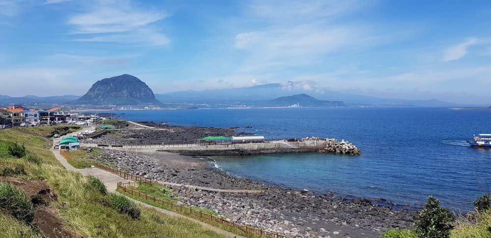 a beach with a mountain in the background